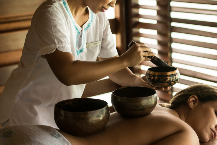 A lady experiencing a spa treatment at Four Seasons Kuda Haruu Maldives