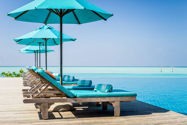 Anantara Dhigu deck chairs and aqua pool