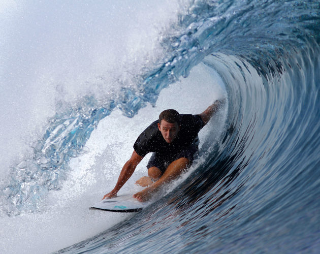 Surfer getting barrelled