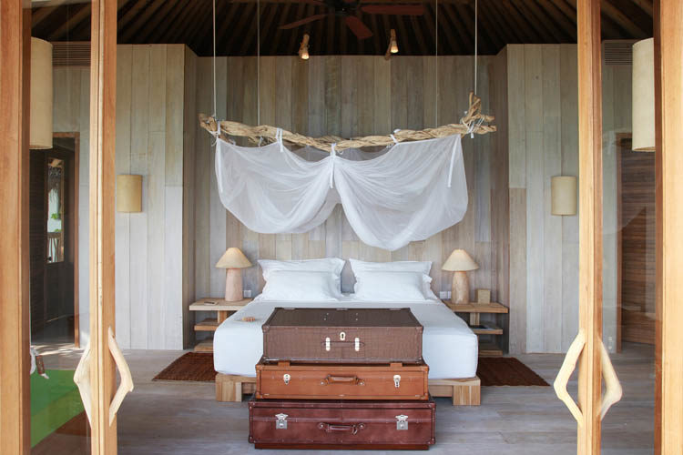 Wayfarers Atlas Soneva Fushi Maldives sunrise villa bedroom. The perfect family-friendly or group surf holiday destination