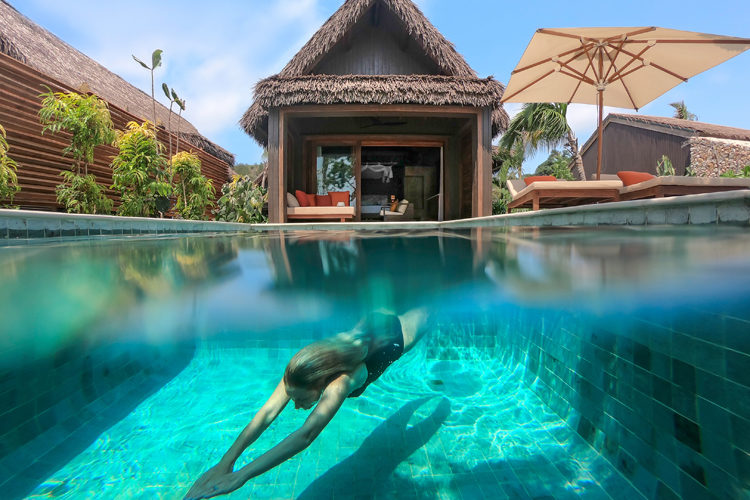 underwater shot of swimmer at Six Senses Malolo Fiji Surf Resort