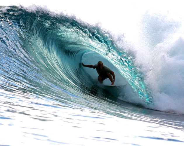 surfer getting barrelled Resort Latitude Zero