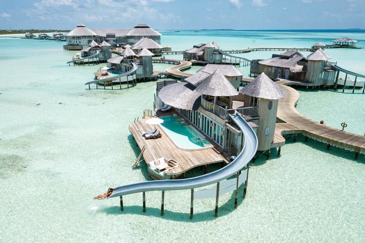 Wayfarers Atlas Luxury Family Surf Resort aerial view of Soneva Jani overwater villas with Waterslide