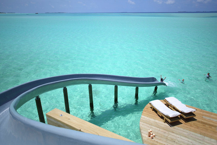 Wayfarers Atlas Luxury Family Surf Resort Soneva Jani waterslide into turquoise waters