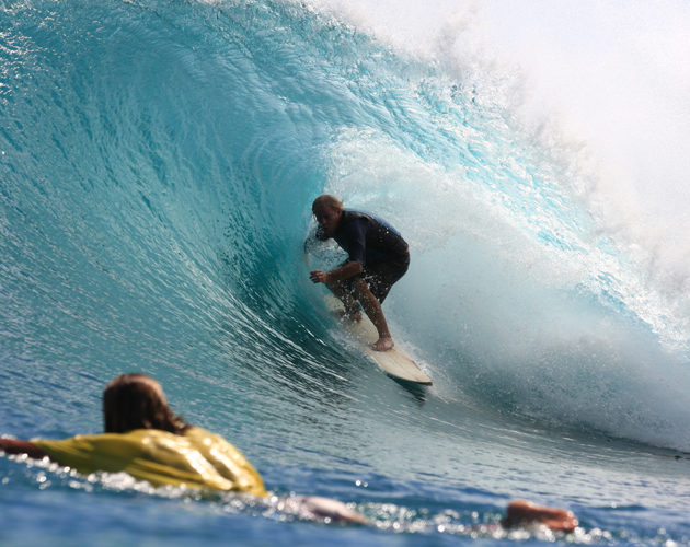 surfer getting barrelled Resort Latitude Zero