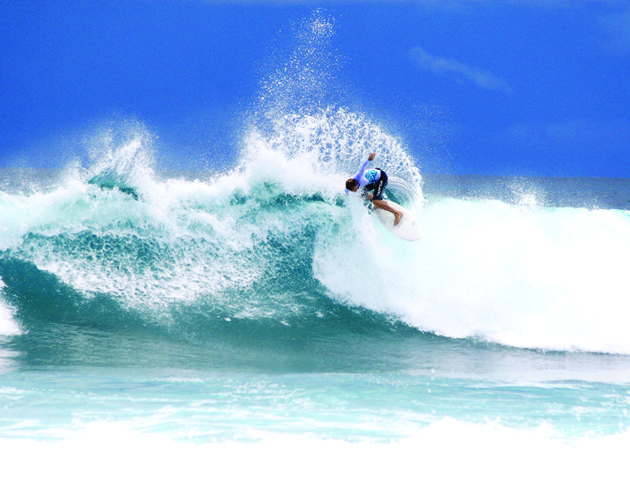 Surfing at Four Seasons Kuda Haruu, Maldives the perfect family surf trip